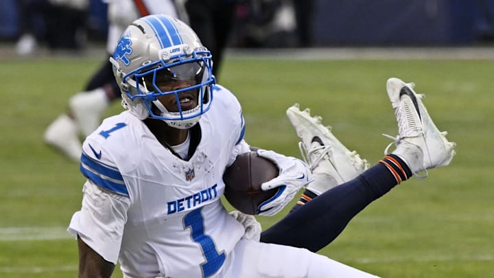 Chicago Bears cornerback Nahshon Wright (26) tackles Detroit Lions wide receiver Jameson Williams (1) 
