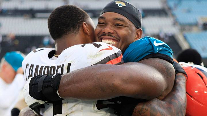 Jacksonville Jaguars defensive end Travon Walker (44) hugs former Jaguars teammate Cleveland Browns cornerback Tyson Campbell (7) after the game of an NFL football matchup at EverBank Stadium on Sunday, Sept. 13, 2026, in Jacksonville, Fla. The Jaguars defeated the Browns 34-10. [Corey Perrine/Florida Times-Union]