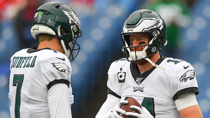 Former Philadelphia Eagles quarterback Nate Sudfeld (7) and quarterback Carson Wentz (11) talk prior to the game against the Buffalo Bills at New Era Field.