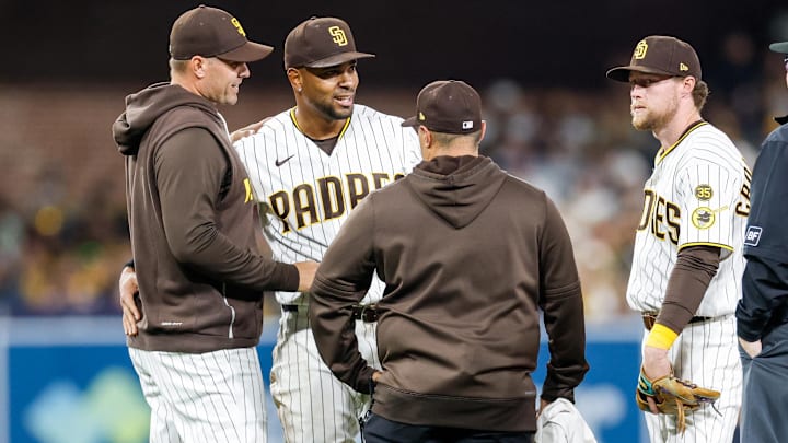 Mar 27, 2026; San Diego, California, USA; San Diego Padres manager Craig Stammen (14) looks at shortstop Xander Bogaerts (2) during sixth inning against the Detroit Tigers at Petco Park. Mandatory Credit: David Frerker-Imagn Images