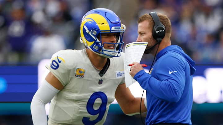 Oct 12, 2025; Baltimore, Maryland, USA; Los Angeles Rams quarterback Matthew Stafford (9) speaks with head coach Sean McVay during the second half of the game against the Baltimore Ravens at M&T Bank Stadium. Mandatory Credit: Peter Casey-Imagn Images