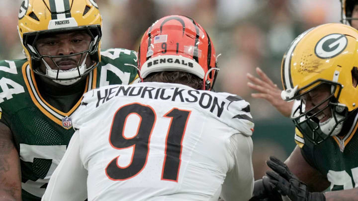 Cincinnati Bengals defensive end Trey Hendrickson (91) is double-teamed by Green Bay Packers center Elgton Jenkins (74) and guard Aaron Banks (65) during the second quarter of their game Sunday. 