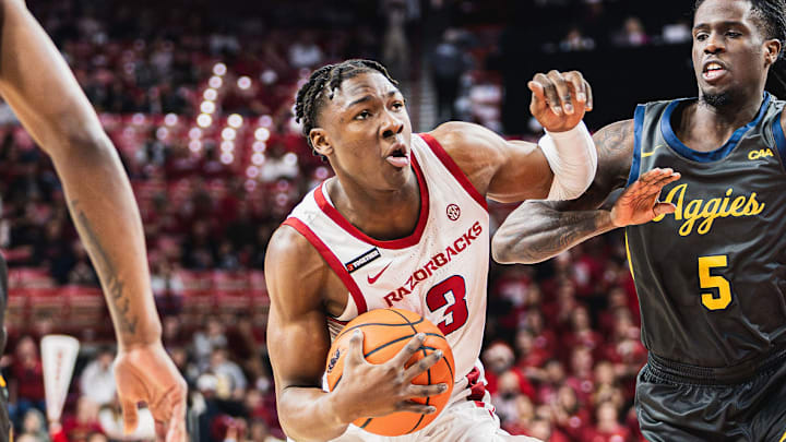 Adou Thiero (3) drives to the basket against the North Carolina A&T Aggies inside Bud Walton Arena. 