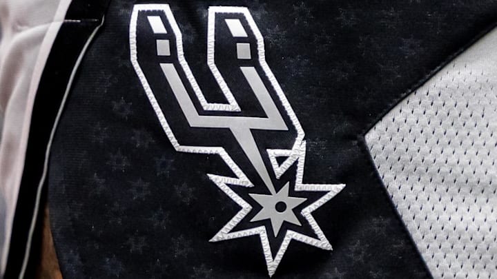 Dec 8, 2025; New Orleans, Louisiana, USA; Details view of the San Antonio Spurs logo against the New Orleans Pelicans during the first half at Smoothie King Center. Dec 8, 2025; New Orleans, Louisiana, USA; Details view of the San Antonio Spurs logo against the New Orleans Pelicans during the first half at Smoothie King Center.