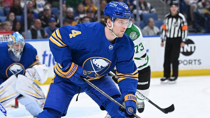 Apr 15, 2026; Buffalo, New York, USA; Buffalo Sabres defenseman Bowen Byram (4) clears the puck from the goal against the Dallas Stars in the third period at KeyBank Center. Apr 15, 2026; Buffalo, New York, USA; Buffalo Sabres defenseman Bowen Byram (4) clears the puck from the goal against the Dallas Stars in the third period at KeyBank Center.