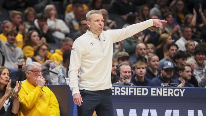 Jan 27, 2026; Morgantown, West Virginia, USA; West Virginia Mountaineers head coach Ross Hodge points during the second half against the Kansas State Wildcats at Hope Coliseum. Jan 27, 2026; Morgantown, West Virginia, USA; West Virginia Mountaineers head coach Ross Hodge points during the second half against the Kansas State Wildcats at Hope Coliseum.