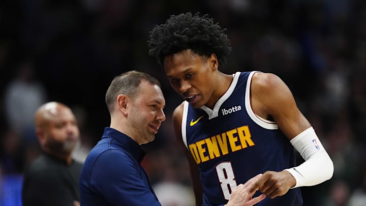 Jan 27, 2026; Denver, Colorado, USA; Denver Nuggets guard Peyton Watson (8) talks to head coach David Adelman during the first quarter against the Detroit Pistons at Ball Arena.