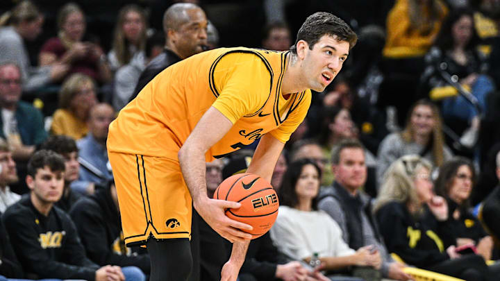 Nov 18, 2025; Iowa City, Iowa, USA; Iowa Hawkeyes forward Alvaro Folgueiras (7) controls the ball against the Southeast Missouri State Redhawks during the first half at Carver-Hawkeye Arena. Mandatory Credit: Jeffrey Becker-Imagn Images