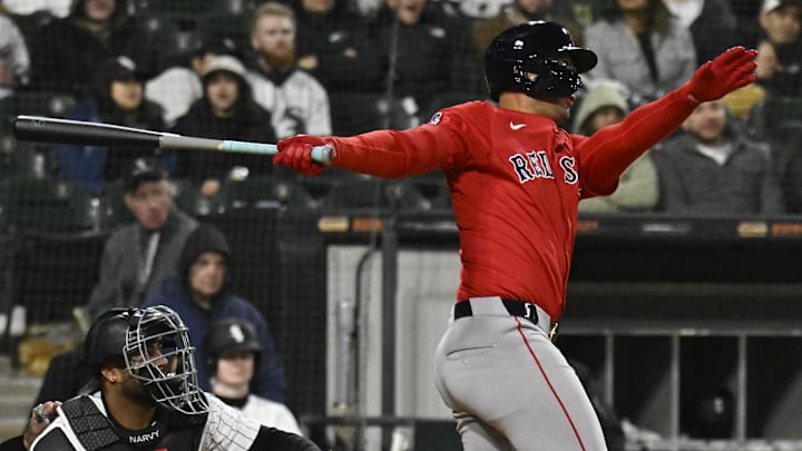 Boston Red Sox catcher Blake Sabol (18) hits a sacrifice fly RBI against the Chicago White Sox at Rate Field. 