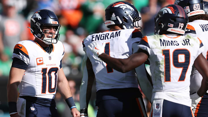 Oct 5, 2025; Philadelphia, Pennsylvania, USA; Denver Broncos tight end Evan Engram (1) celebrates with quarterback Bo Nix (10) and wide receiver Marvin Mims Jr. (19) after scoring a touchdown against the Philadelphia Eagles in the second half at Lincoln Financial Field. 