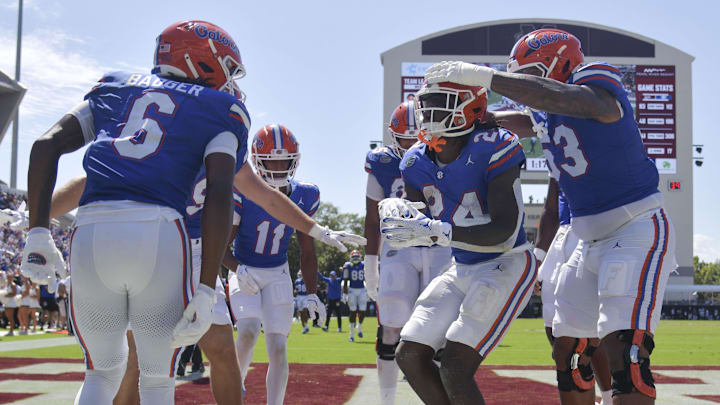 Florida Gators running back Ja'Kobi Jackson (24) celebrates with teammates after a touchdown against the Mississippi State Bulldogs during the second quarter at Davis Wade Stadium at Scott Field.