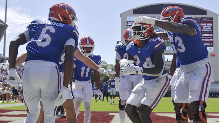 Florida Gators running back Ja'Kobi Jackson (24) celebrates with teammates after a touchdown against the Mississippi State Bulldogs during the second quarter at Davis Wade Stadium at Scott Field.