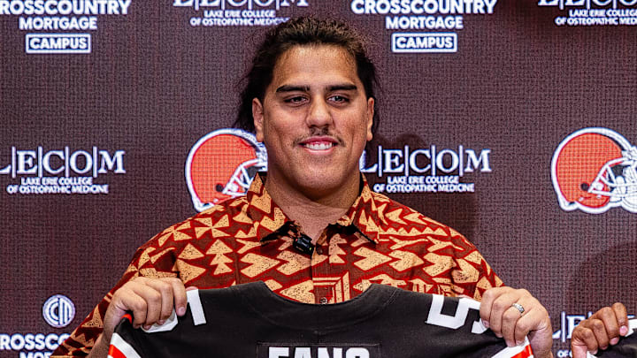 Apr 24, 2026; Berea, OH, USA; Cleveland Browns first round draft picks Spencer Fano, left, and KC Concepcion hold their new jerseys during an introductory press conference at CrossCountry Mortgage Campus. Mandatory Credit: Ken Blaze-Imagn Images