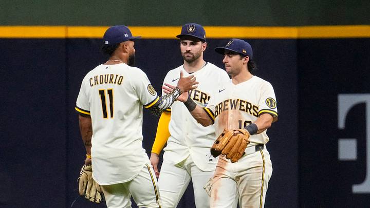 Jun 29, 2026; Milwaukee, Wisconsin, USA; Milwaukee Brewers left fielder Jackson Chourio (11), center fielder Garrett Mitchell (5) and right fielder Sal Frelick (10) celebrate a 5-3 win over the Cincinnati Reds at American Family Field. Mandatory Credit: Michael McLoone-Imagn Images