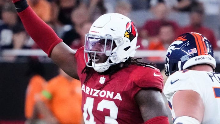Arizona Cardinals linebacker Jesse Luketa (43) reacts after sacking Denver Broncos quarterback Russell Wilson (3) during a preseason game at State Farm Stadium in Glendale on Aug. 11, 2023