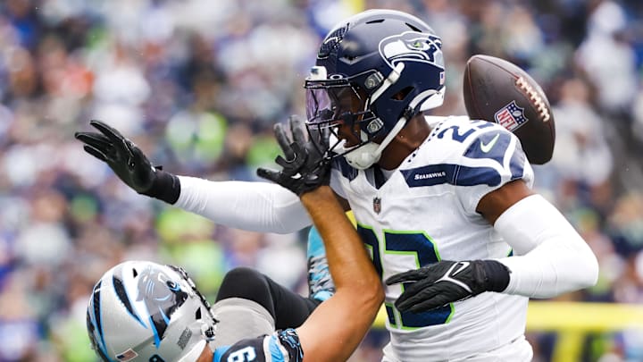 Sep 24, 2023; Seattle, Washington, USA; Seattle Seahawks cornerback Artie Burns (23) defends a pass intended for Carolina Panthers wide receiver Adam Thielen (19) during the second quarter at Lumen Field.