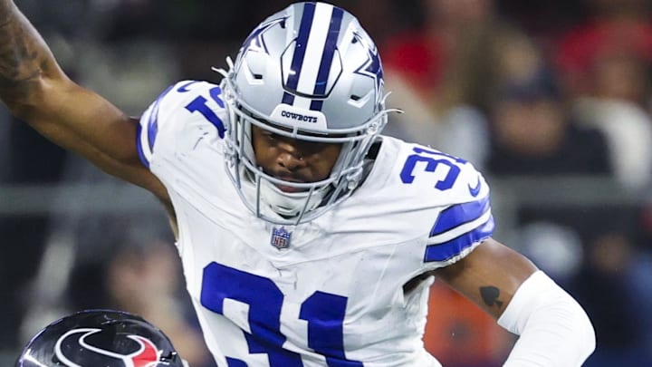 Nov 18, 2024; Arlington, Texas, USA; Houston Texans wide receiver Tank Dell (3) catches a pass as Dallas Cowboys cornerback Josh Butler (31) defends during the second half at AT&T Stadium. Mandatory Credit: Kevin Jairaj-Imagn Images