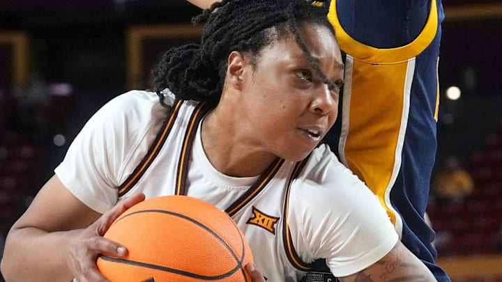 ASU Sun Devils guard Gabby Elliott (0) tries to drive past Coppin State Bald Eagles guard Khila Morris (24) at Desert Financial Arena on Nov. 3, 2025.