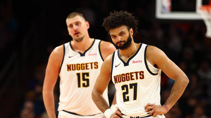Nov 29, 2025; Phoenix, Arizona, USA; Denver Nuggets guard Jamal Murray (27) and center Nikola Jokic (15) against the Phoenix Suns at the Mortgage Matchup Center. Nov 29, 2025; Phoenix, Arizona, USA; Denver Nuggets guard Jamal Murray (27) and center Nikola Jokic (15) against the Phoenix Suns at the Mortgage Matchup Center.