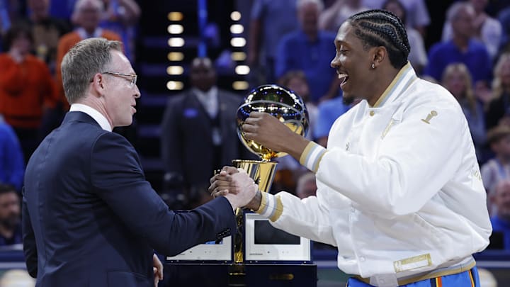 Oct 21, 2025; Oklahoma City, Oklahoma, USA; Oklahoma City Thunder general manager Sam Presti shakes hands with guard Jalen Williams during the championship ring ceremony before a game against the Houston Rockets at Paycom Center. Mandatory Credit: Alonzo Adams-Imagn Images