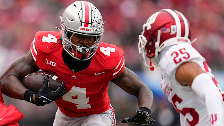 Ohio State Buckeyes wide receiver Jeremiah Smith (4) runs toward Indiana Hoosiers defensive back Amare Ferrell (25) during the second half of the NCAA football game at Ohio Stadium in Columbus on Saturday, Nov. 23, 2024. Ohio State won 38-15. Ohio State Buckeyes wide receiver Jeremiah Smith (4) runs toward Indiana Hoosiers defensive back Amare Ferrell (25) during the second half of the NCAA football game at Ohio Stadium in Columbus on Saturday, Nov. 23, 2024. Ohio State won 38-15.