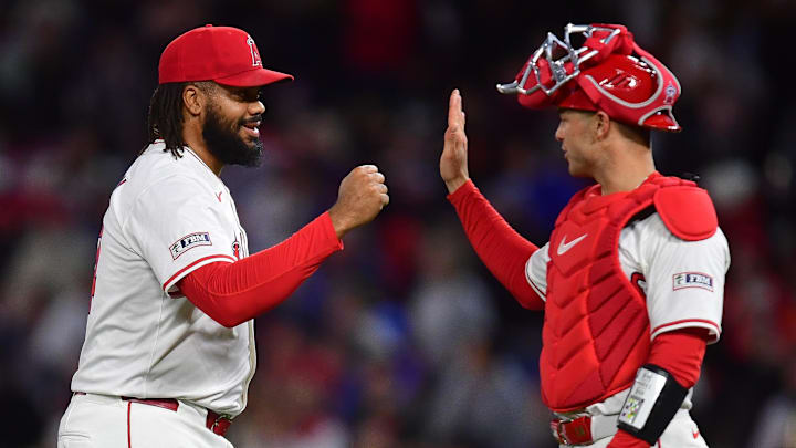 Apr 18, 2025; Anaheim, California, USA; Los Angeles Angels pitcher Kenley Jansen (74) and catcher Logan O'Hoppe (14) celebrate the victory against the San Francisco Giants at Angel Stadium. 