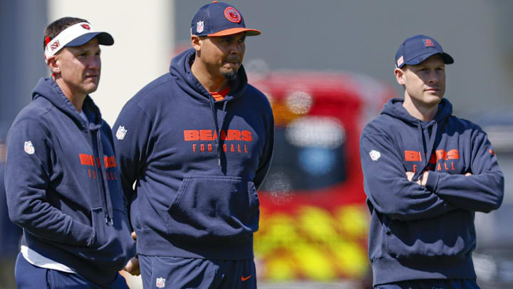 May 9, 2025; Lake Forest, IL, USA; Chicago Bears defensive coordinator Dennis Allen (L), general manager Ryan Poles (C) and head coach Ben Johnson (R) observe during the Rookie Minicamp at Halas Hall.