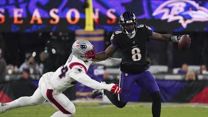 Lamar Jackson was forced to leave Sunday’s loss to the Patriots early with a back injury. 