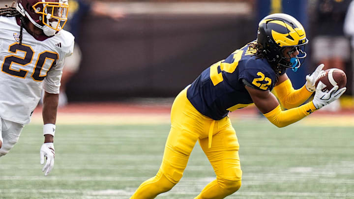 Michigan defensive back Elijah Dotson (22) intercepts a pass intended for Central Michigan wide receiver Langston Lewis (20) during the second half at Michigan Stadium in Ann Arbor on Saturday, Sept. 13, 2025. Michigan defensive back Elijah Dotson (22) intercepts a pass intended for Central Michigan wide receiver Langston Lewis (20) during the second half at Michigan Stadium in Ann Arbor on Saturday, Sept. 13, 2025.