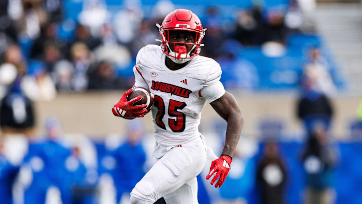 Nov 30, 2024; Lexington, Kentucky, USA; Louisville Cardinals running back Isaac Brown (25) runs the ball during the third quarter against the Kentucky Wildcats at Kroger Field. Mandatory Credit: Jordan Prather-Imagn Images Nov 30, 2024; Lexington, Kentucky, USA; Louisville Cardinals running back Isaac Brown (25) runs the ball during the third quarter against the Kentucky Wildcats at Kroger Field. Mandatory Credit: Jordan Prather-Imagn Images