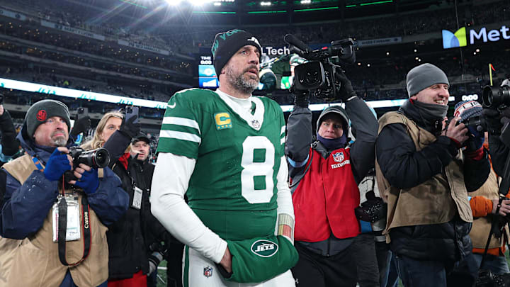 New York Jets quarterback Aaron Rodgers (8) walks on the field after the game against the Miami Dolphins New York Jets quarterback Aaron Rodgers (8) walks on the field after the game against the Miami Dolphins