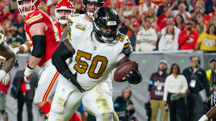 Oct 7, 2024; Kansas City, Missouri, USA; New Orleans Saints defensive tackle Khalen Saunders (50) intercepts a pass intended for Kansas City Chiefs wide receiver JuJu Smith-Schuster (9) (not pictured) during the second half at GEHA Field at Arrowhead Stadium. Mandatory Credit: Denny Medley-Imagn Images