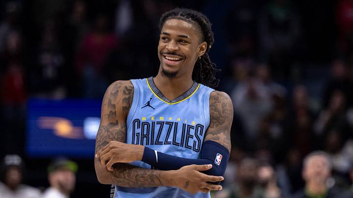 Dec 26, 2023; New Orleans, Louisiana, USA; Memphis Grizzlies guard Ja Morant (12) smiles at a fan as the end of regulation against the New Orleans Pelicans at Smoothie King Center. Mandatory Credit: Stephen Lew-USA TODAY Sports
