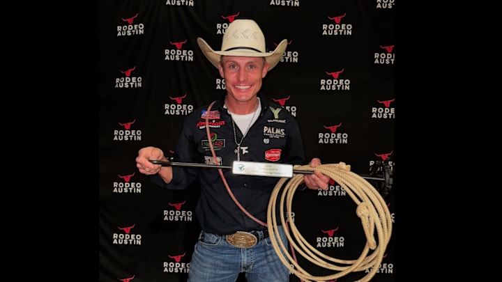 Tuf Cooper shows off the branding iron prize given to Rodeo Austin winners following his success over the weekend. 