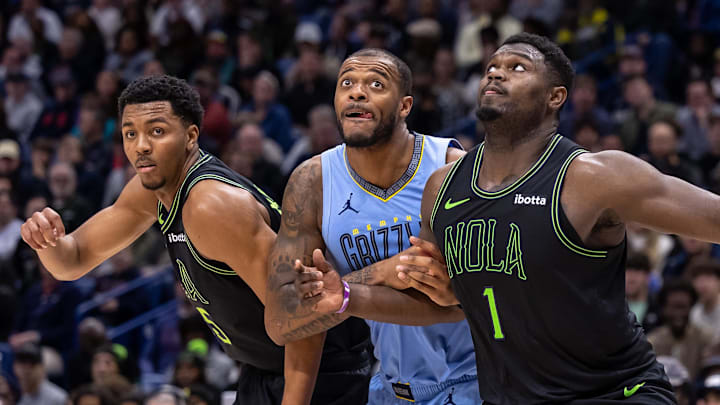 Dec 26, 2023; New Orleans, Louisiana, USA; New Orleans Pelicans forward Zion Williamson (1) and New Orleans Pelicans guard Trey Murphy III (25) hold back the Memphis Grizzlies on a free throw attempt during the second half at the Smoothie King Center. Mandatory Credit: Stephen Lew-Imagn Images