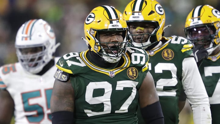 Nov 28, 2024; Green Bay, Wisconsin, USA; Green Bay Packers defensive tackle Kenny Clark (97) celebrates sacking Miami Dolphins quarterback Tua Tagovailoa with defensive end Rashan Gary (52) and linebacker Quay Walker (7) at Lambeau Field. Mandatory Credit: Dan Powers-Imagn Images Nov 28, 2024; Green Bay, Wisconsin, USA; Green Bay Packers defensive tackle Kenny Clark (97) celebrates sacking Miami Dolphins quarterback Tua Tagovailoa with defensive end Rashan Gary (52) and linebacker Quay Walker (7) at Lambeau Field. Mandatory Credit: Dan Powers-Imagn Images