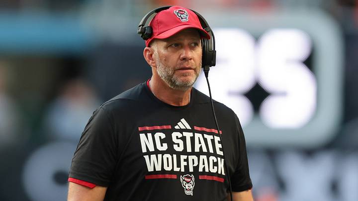 Nov 15, 2025; Miami Gardens, Florida, USA; NC State Wolfpack head coach Dave Doeren looks on against Miami Hurricanes during the second quarter at Hard Rock Stadium. Nov 15, 2025; Miami Gardens, Florida, USA; NC State Wolfpack head coach Dave Doeren looks on against Miami Hurricanes during the second quarter at Hard Rock Stadium.