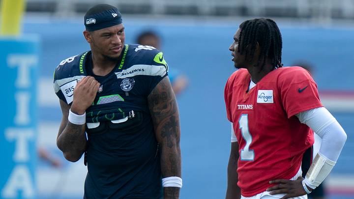 Seattle Seahawks tight end Elijah Arroyo (18) and Tennessee Titans quarterback Cam Ward (1) talk after the joint practice with the Seattle Seahawks at Vanderbilt Health Football Center Friday, Aug. 21, 2026. Seattle Seahawks tight end Elijah Arroyo (18) and Tennessee Titans quarterback Cam Ward (1) talk after the joint practice with the Seattle Seahawks at Vanderbilt Health Football Center Friday, Aug. 21, 2026.