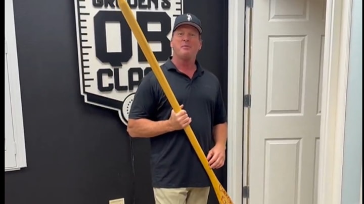 Jon Gruden unboxing a package of merchandise from the Gophers football program Jon Gruden unboxing a package of merchandise from the Gophers football program