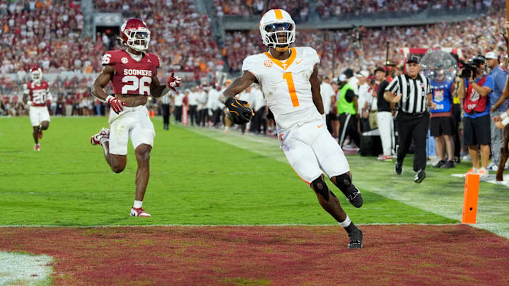 Tennessee Volunteers wide receiver Dont'e Thornton Jr. (1) scores a touchdown in front of Oklahoma Sooners defensive back Kani Walker (26) during a college football game between the University of Oklahoma Sooners (OU) and the Tennessee Volunteers at Gaylord Family - Oklahoma Memorial Stadium in Norman, Okla., Saturday, Sept. 21, 2024.