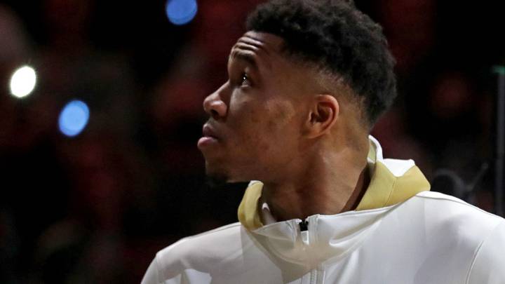 Milwaukee Bucks forward Giannis Antetokounmpo (34) watches as the Milwaukee Bucks' 2021 championship banner is unveiled with his Championship ring during the Milwaukee Bucks ring ceremony on Oct. 19, 2021.