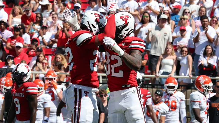 Texas Tech safety Marcus Ramon-Edwards (22) and outside linebacker LaDamion Guyton (32) celebrate during their 49–14 win over Sam Houston. Texas Tech safety Marcus Ramon-Edwards (22) and outside linebacker LaDamion Guyton (32) celebrate during their 49–14 win over Sam Houston.