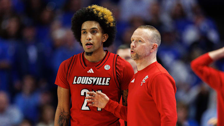 Dec 14, 2024; Lexington, Kentucky, USA; Louisville Cardinals head coach Pat Kelsey talks to guard Chucky Hepburn (24) during the second half against the Kentucky Wildcats at Rupp Arena at Central Bank Center.