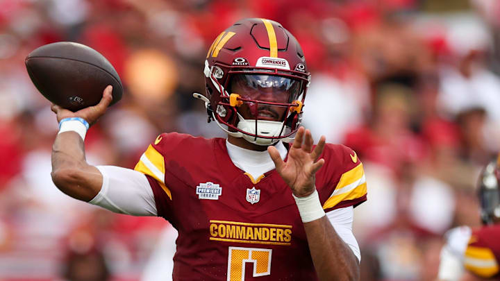 Washington Commanders quarterback Jayden Daniels (5) drops back to pass against the Tampa Bay Buccaneers in the third quarter at Raymond James Stadium. Mandatory Credit: Nathan Ray Seebeck-Imagn Images