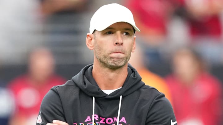 Oct 5, 2025; Glendale, Arizona, USA; Arizona Cardinals head coach Jonathan Gannon stands on the field before their game against the Tennessee Titans at State Farm Stadium. Mandatory Credit: Joe Camporeale-Imagn Images
