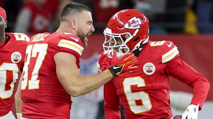 Nov 5, 2023; Frankfurt, Germany, ;  Kansas City Chiefs tight end Travis Kelce (87) congratulates safety Bryan Cook (6) after scoring a touchdown against the Miami Dolphins in the second quarter during an NFL International Series game at Deutsche Bank Park. Mandatory Credit: Nathan Ray Seebeck-Imagn Images