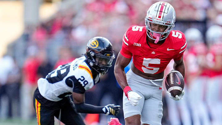 Ohio State Buckeyes wide receiver Mylan Graham (5) runs past Grambling State Tigers defensive back Christen Williams (29) during the second half of the NCAA football game at Ohio Stadium on Sept. 6, 2025. Ohio State won 70-0.