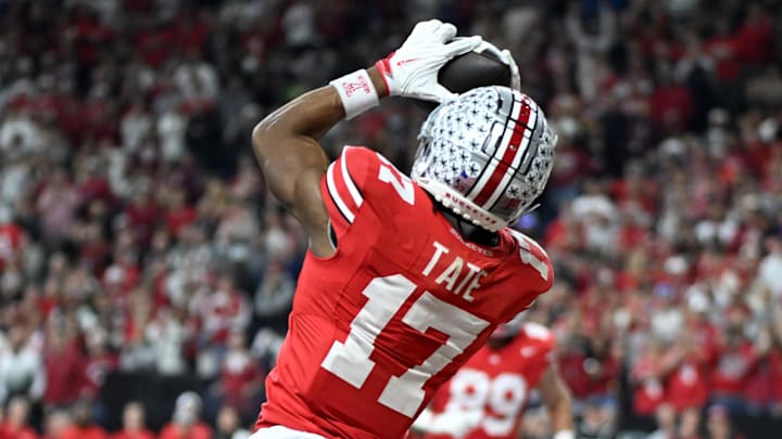Dec 6, 2025; Indianapolis, IN, USA; Ohio State Buckeyes wide receiver Carnell Tate (17) scores a touchdown against the Indiana Hoosiers in the first quarter during the 2025 Big Ten championship game at Lucas Oil Stadium. Mandatory Credit: Robert Goddin-Imagn Images