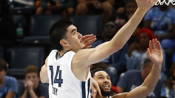 Oct 30, 2024; Memphis, Tennessee, USA; Memphis Grizzlies center Zach Edey (14) shoots as Brooklyn Nets guard Ben Simmons (10) defends during the first half at FedExForum. Mandatory Credit: Petre Thomas-Imagn Images