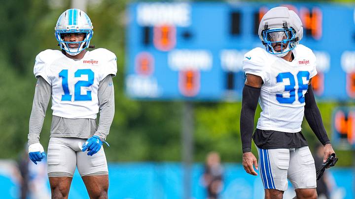 Detroit Lions safety Thomas Harper (12), left, and safety Chuck Clark (36) during training camp at Meijer Performance Center in Allen Park on Monday, August 10, 2026.